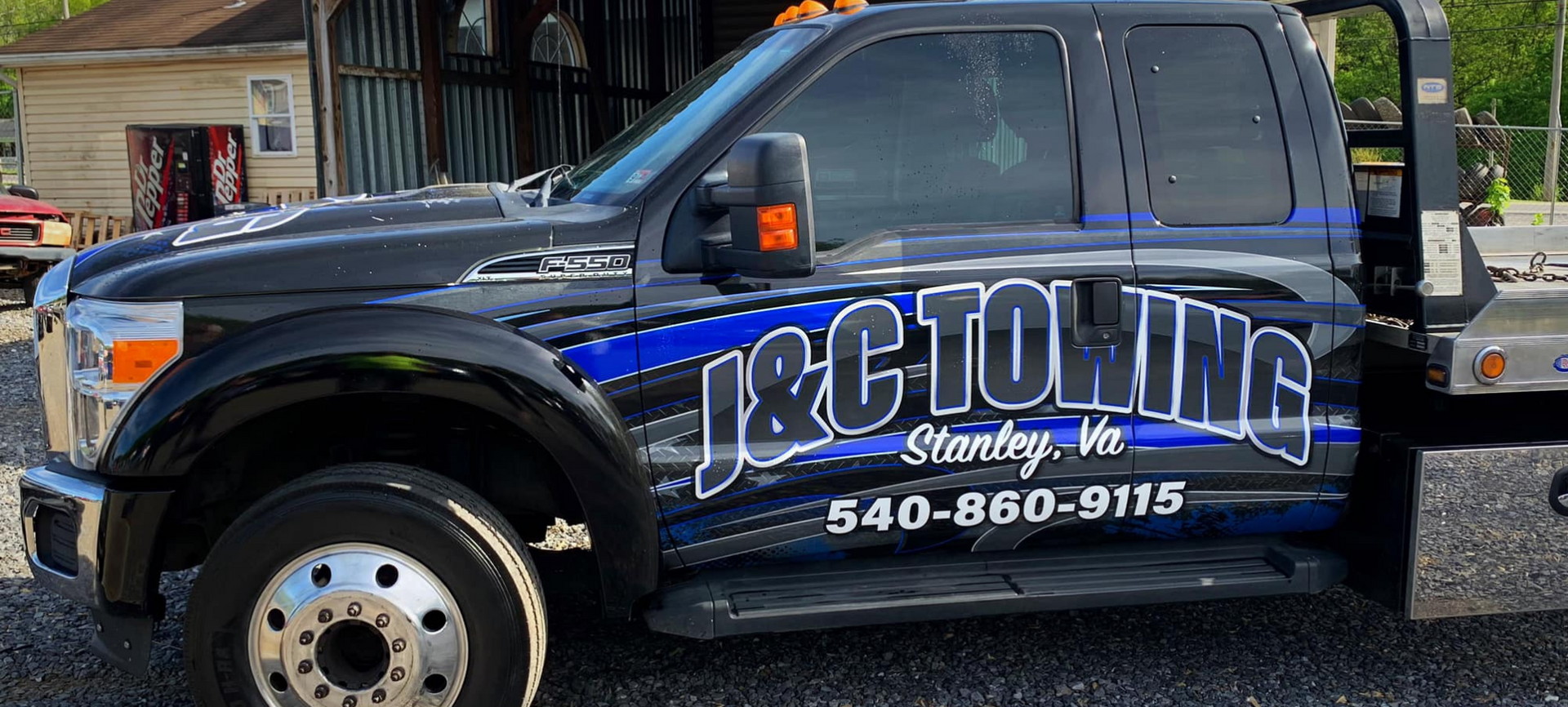 Black tow truck with “J&C TOWING” logo, in Stanley, Va. Phone number: 840-860-9115.