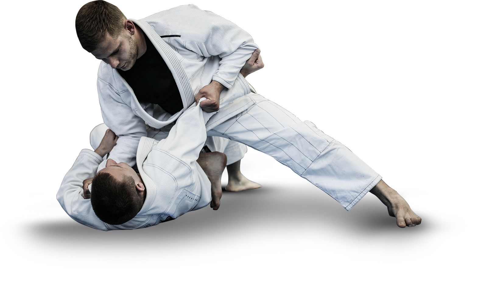 Two men are fighting each other in a karate match.