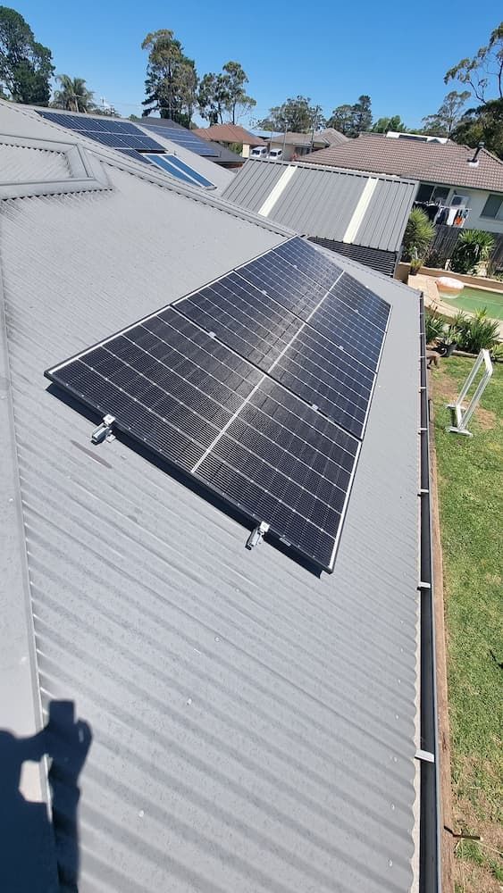 A Roof With a Lot of Solar Panels on It — JNQ Solar & Electrical in Fairy Meadow, NSW