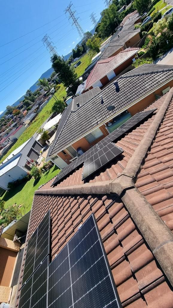 A Roof With a Lot of Solar Panels on It — JNQ Solar & Electrical in Fairy Meadow, NSW