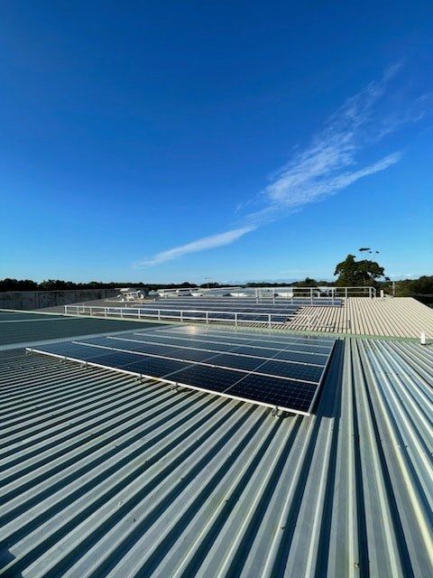 A Roof With a Lot of Solar Panels on it — JNQ Solar & Electrical in Woonona, NSW