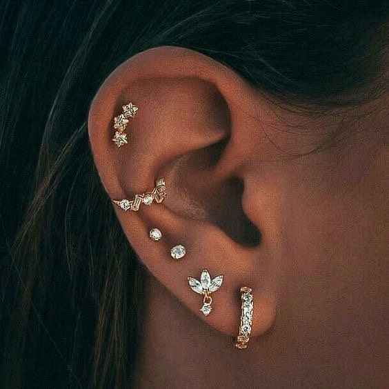 A Close Up of a Woman's Ear With Multiple Piercings — Aqua Marine Skin and Beauty in Tuncurry, NSW