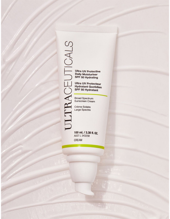White tube of Ultraceuticals sunscreen on a textured white surface; SPF 50+. — Aqua Marine Skin and Beauty in Tuncurry, NSW