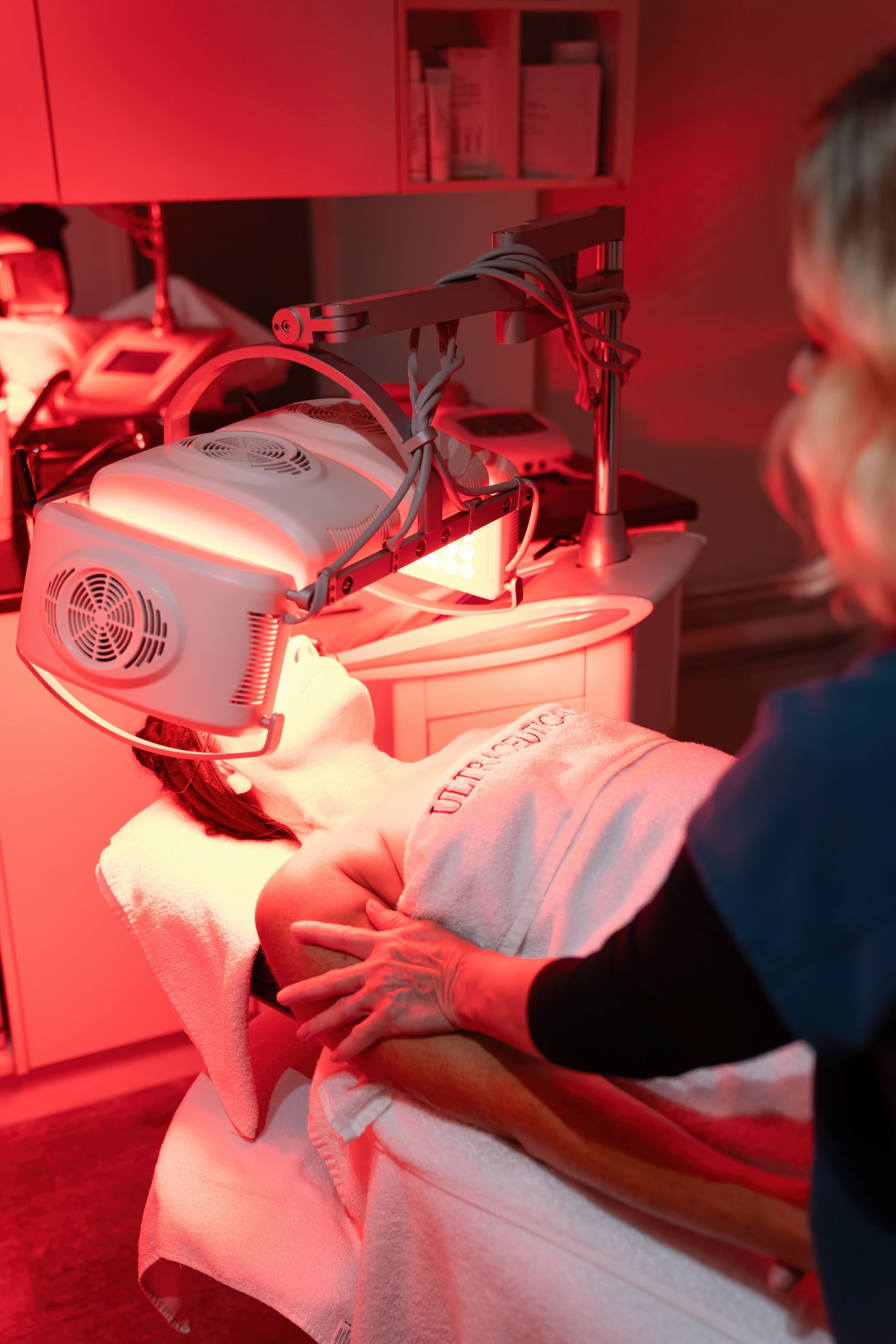Woman Receiving Facial Treatment; Technician Using Device over head — Aqua Marine Skin and Beauty in Forster, NSW