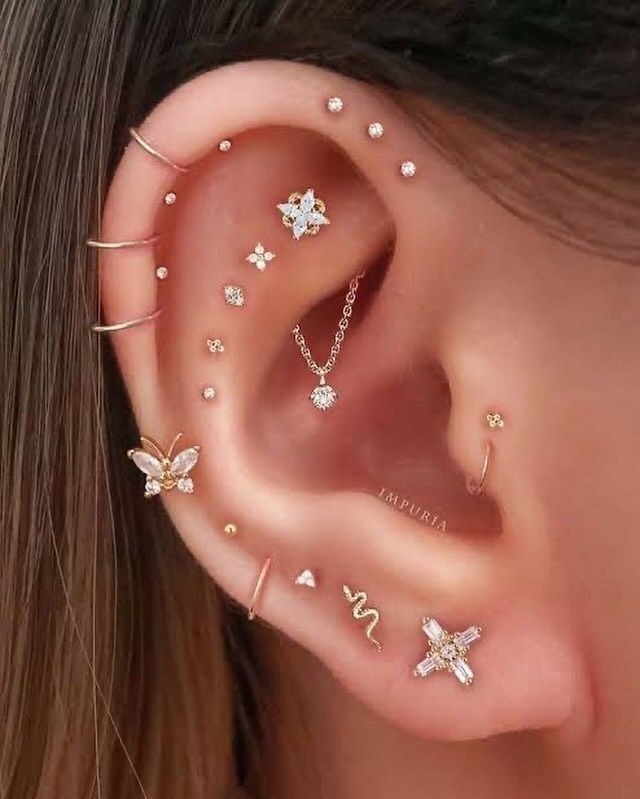 A Close Up of a Woman's Ear With a Lot of Piercings — Aqua Marine Skin and Beauty in Tuncurry, NSW