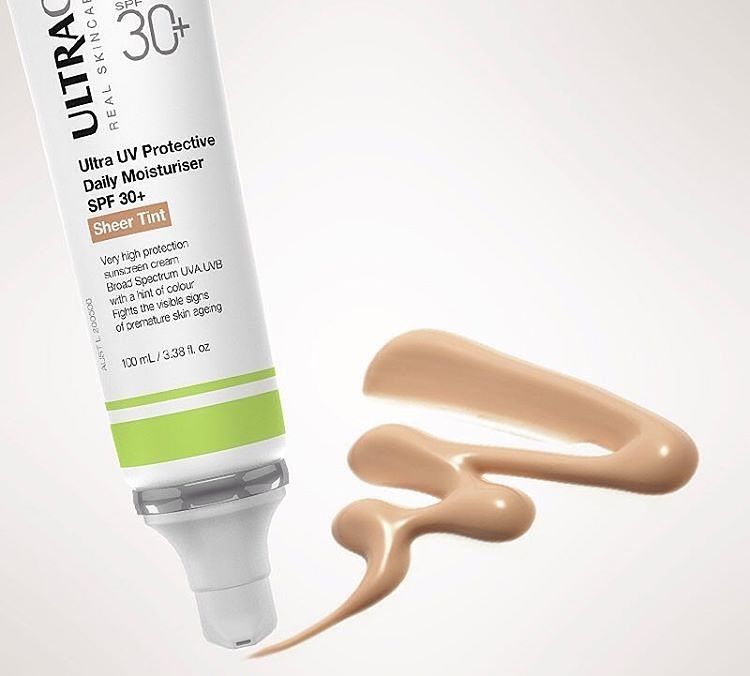 Tube of tinted sunscreen with a swatch of product. — Aqua Marine Skin and Beauty in Tuncurry, NSW