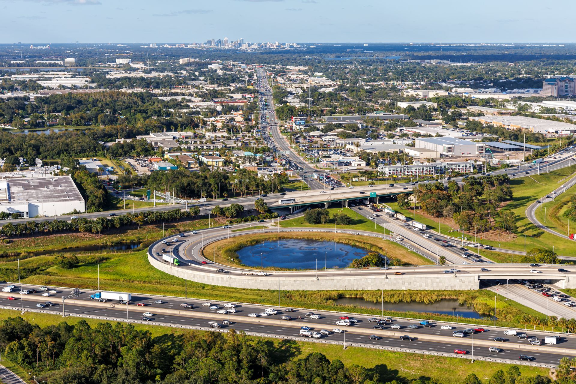 An aerial view of a parking lot in front of a building.