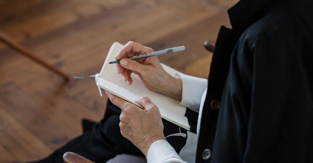 therapist taking notes in a notebook