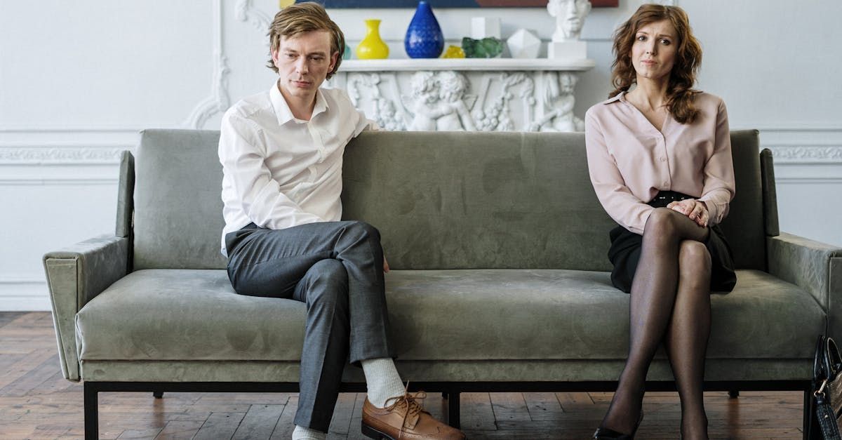 a man and a woman on a couch at a therapy session