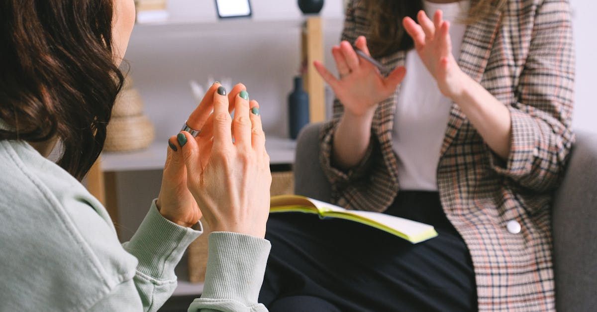 two women talking with their hands