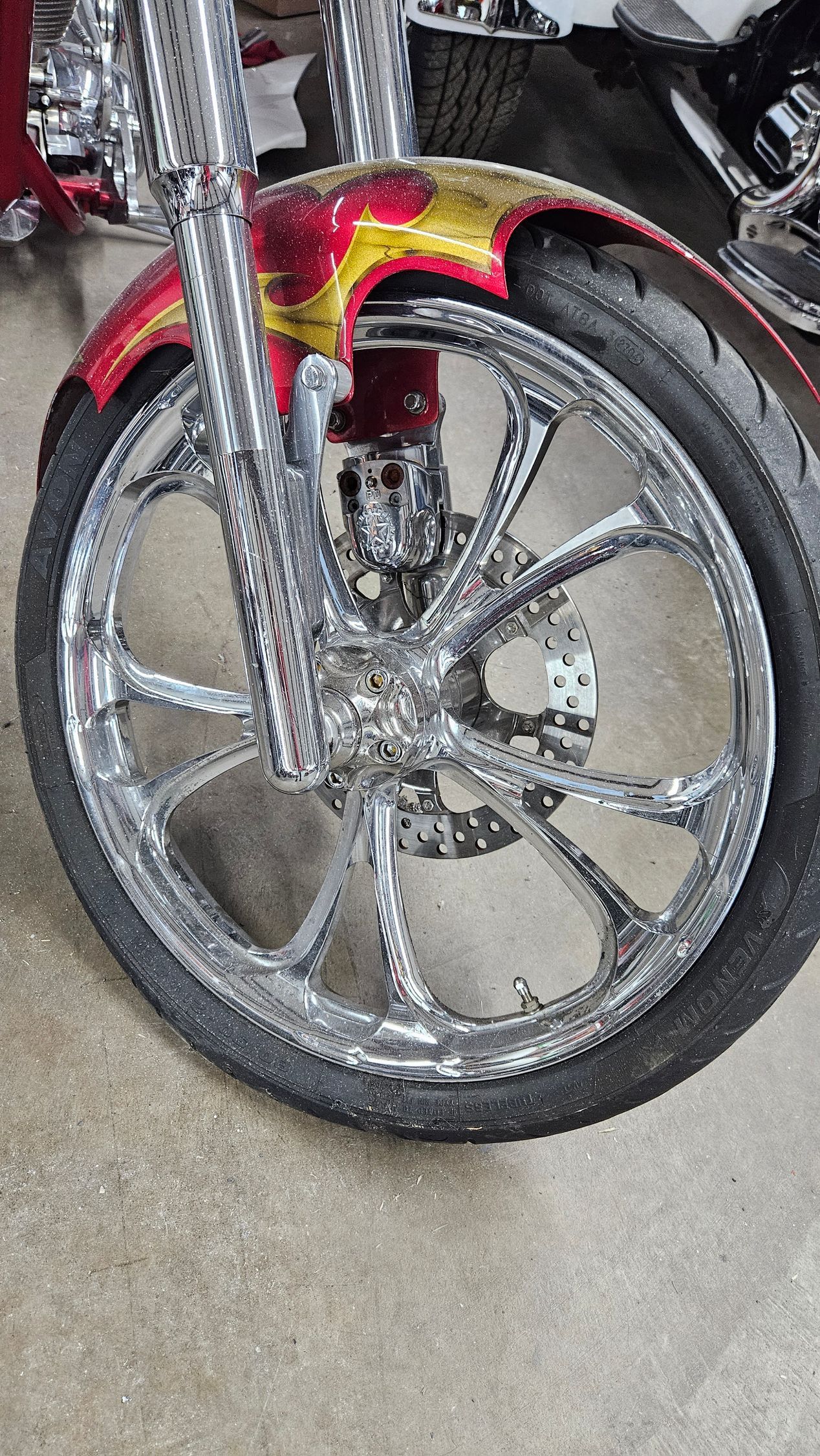 A close up of the front wheel of a motorcycle.