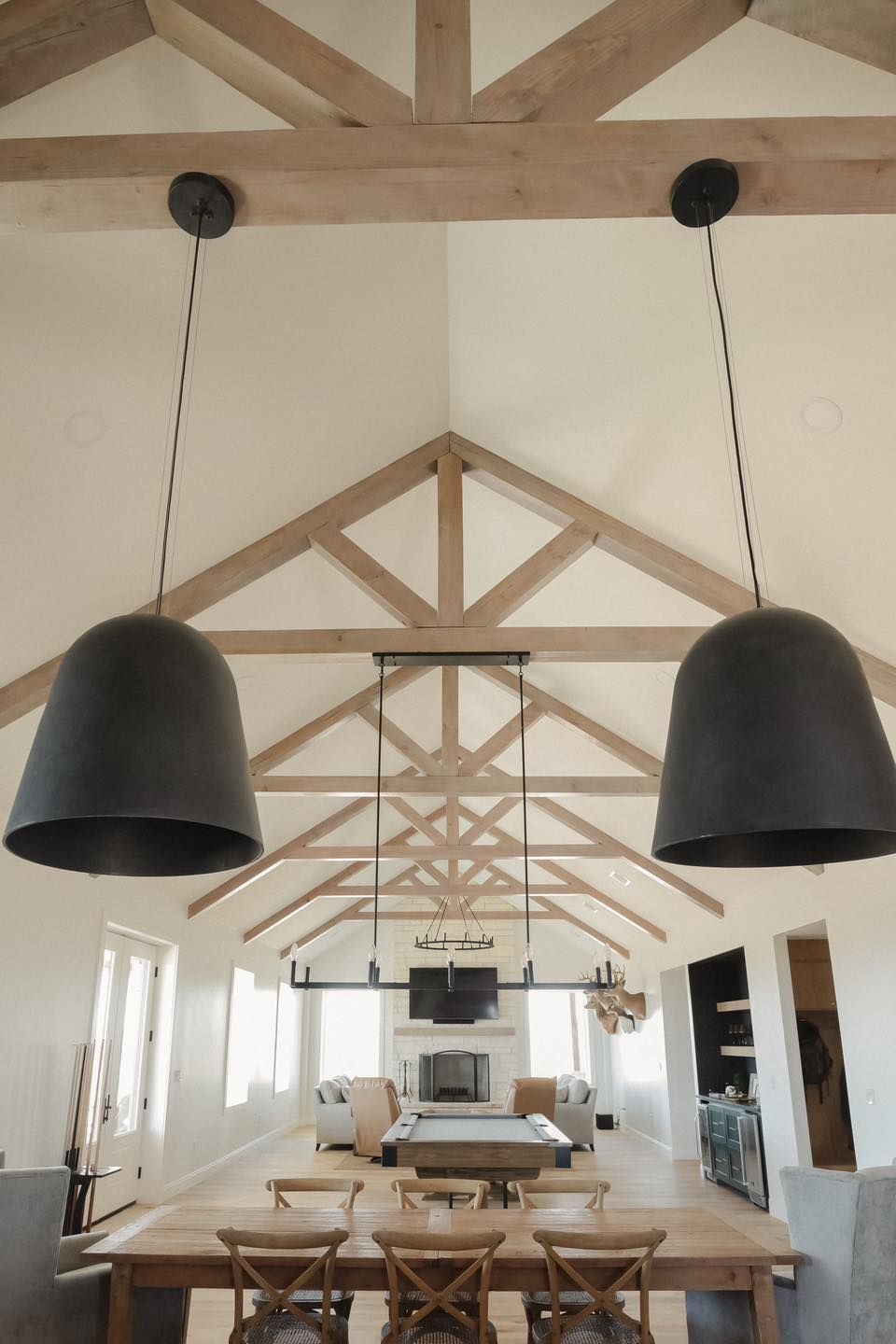 A dining room with a table and chairs and a fireplace