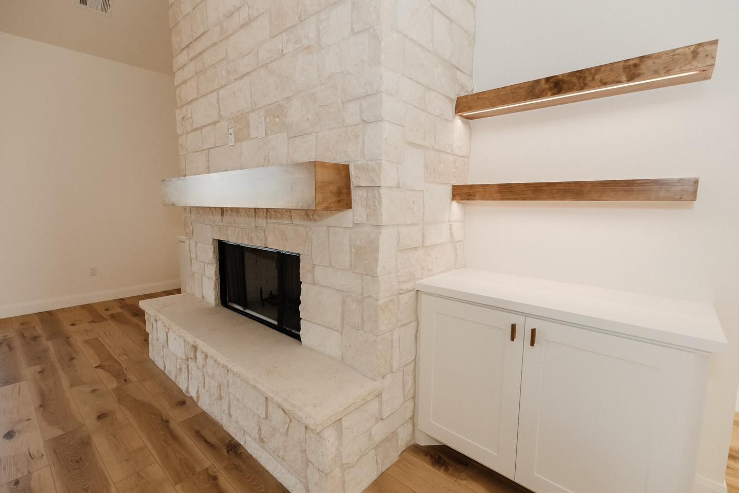 There is a fireplace in the middle of the room.