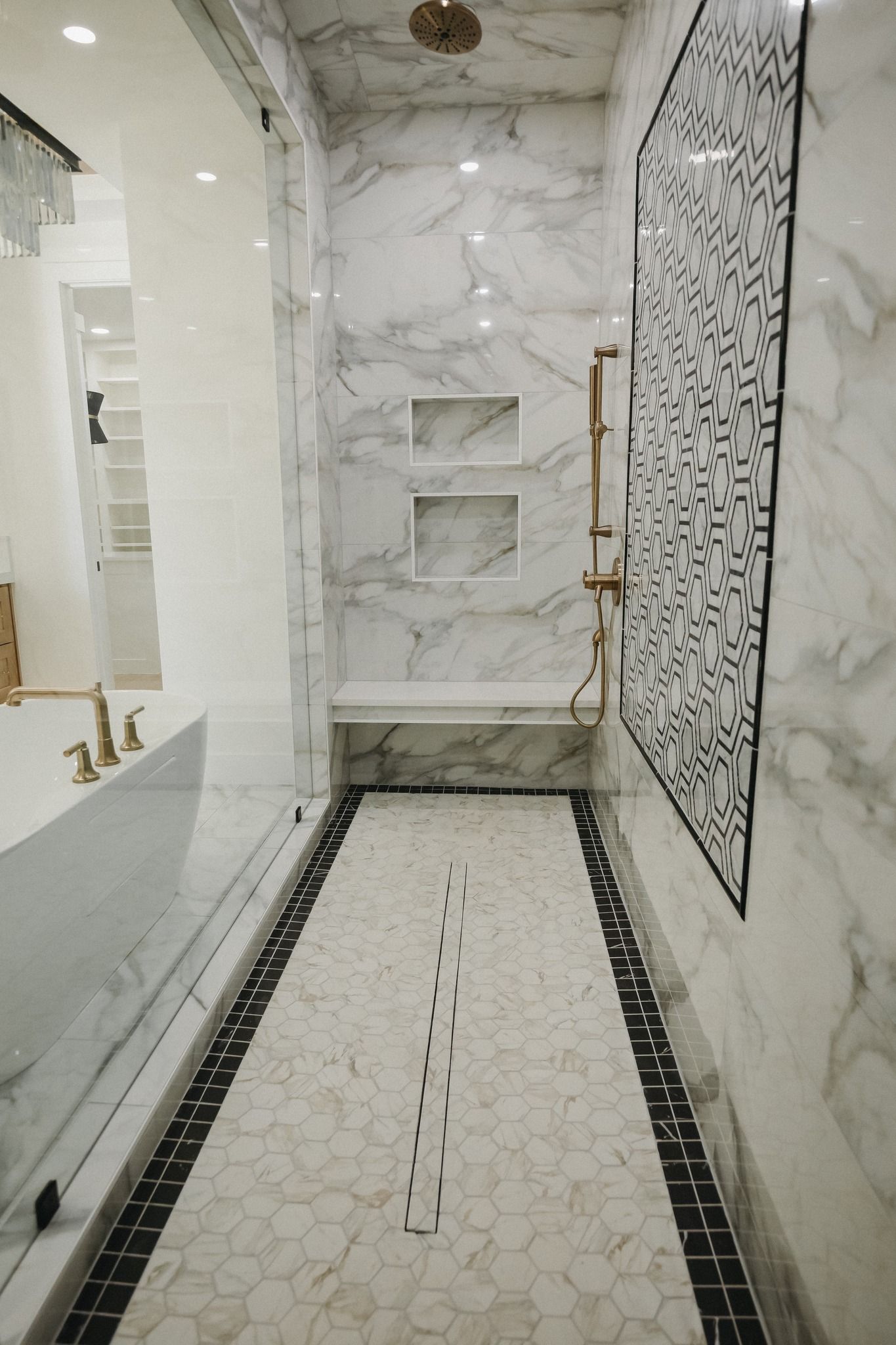 A bathroom with a walk in shower and a bathtub.