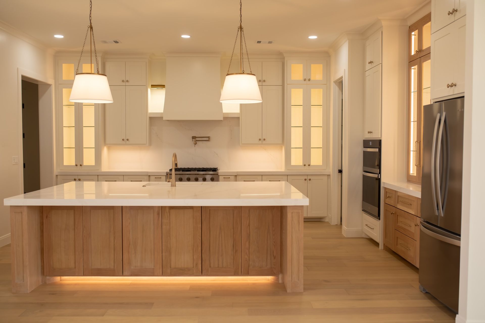 A kitchen with a large island in the middle of the room.