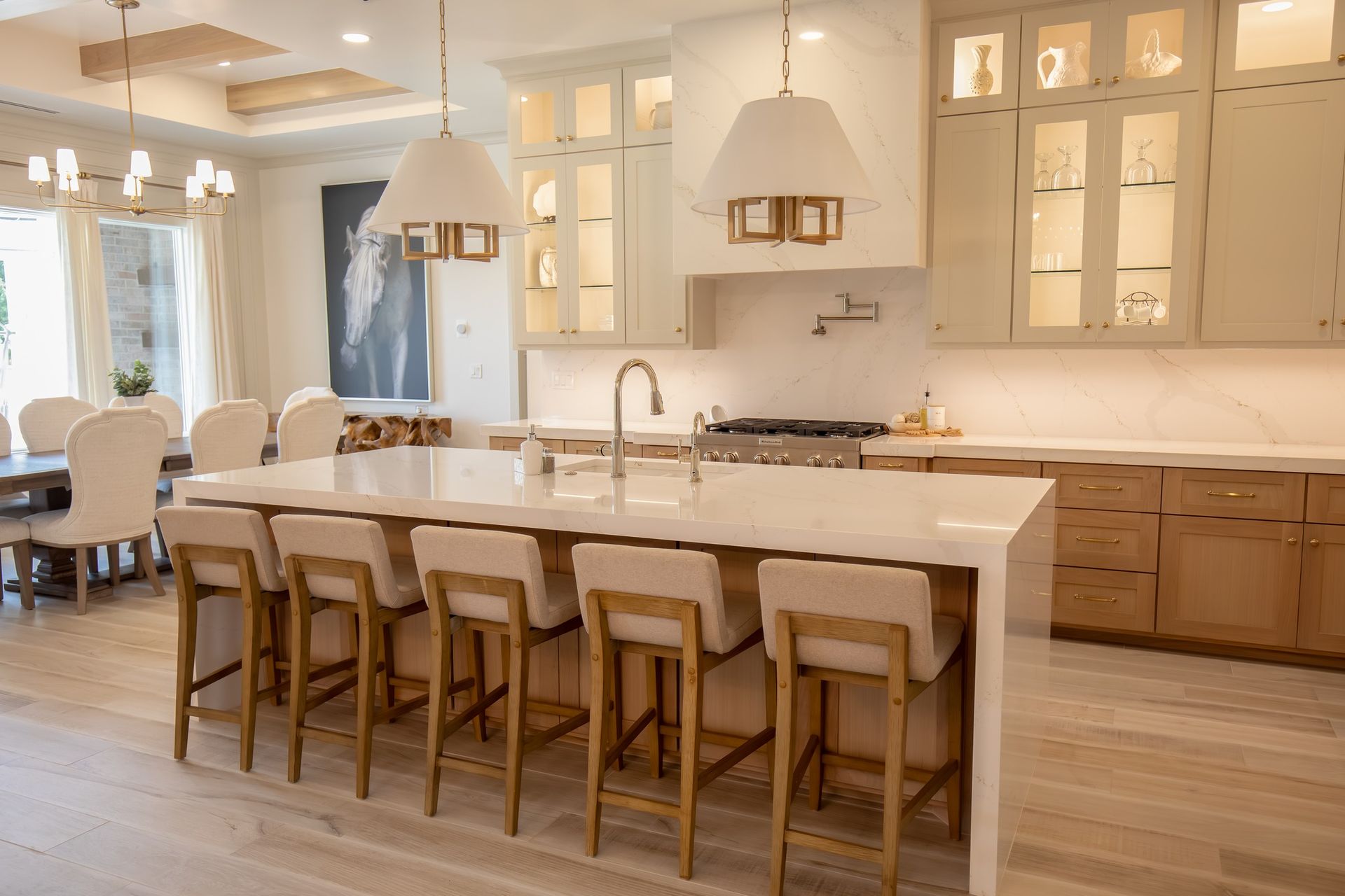A large kitchen with a large island and stools.