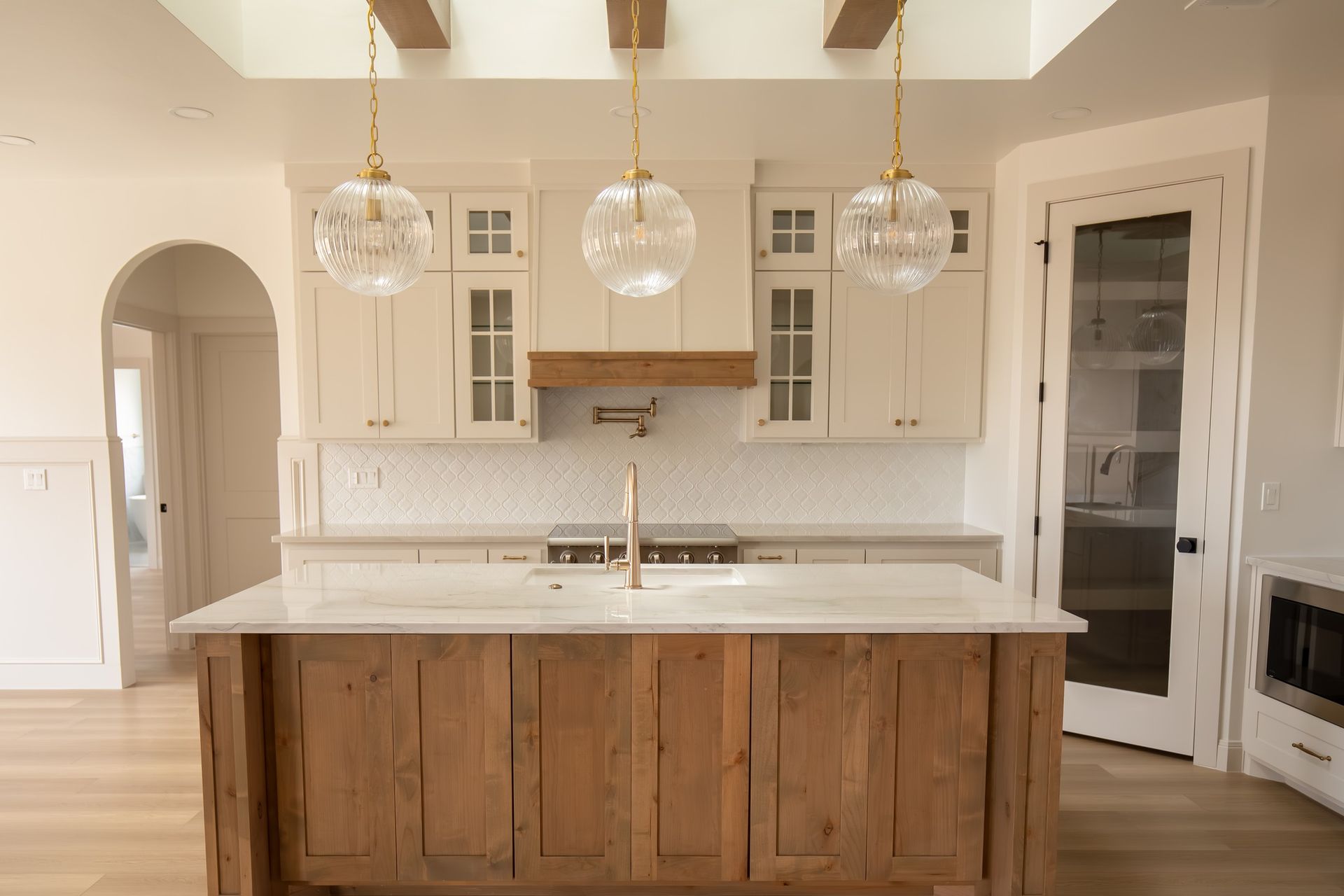 There is a large island in the middle of the kitchen.