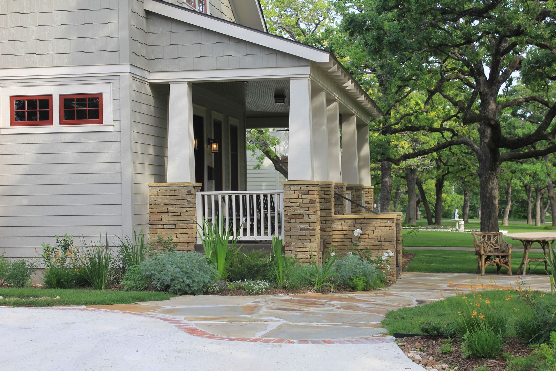 A house with a porch and a stone walkway