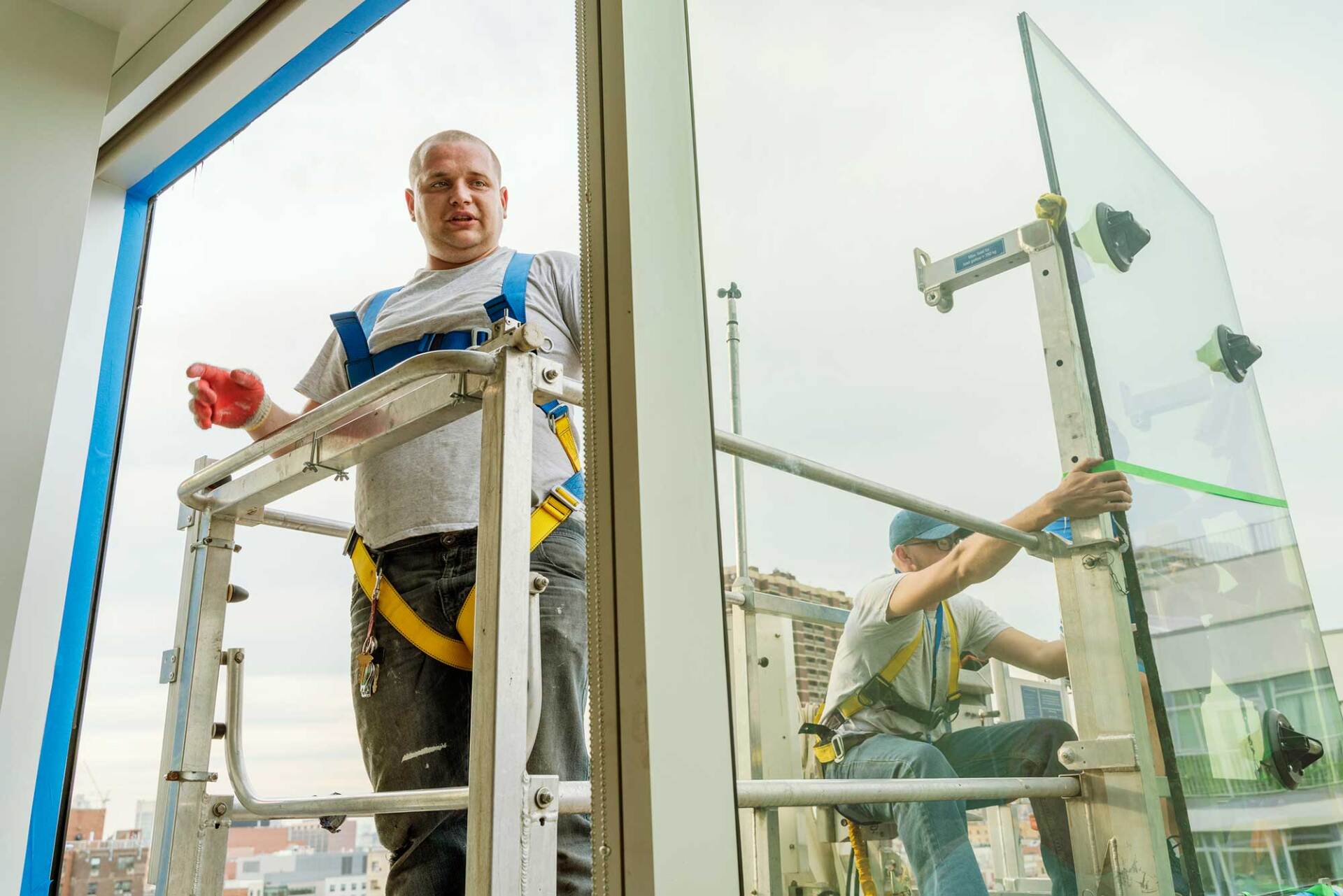 Workers Replacing a Broken Window in the Office Building — San Antonio, TX — Mission Glass