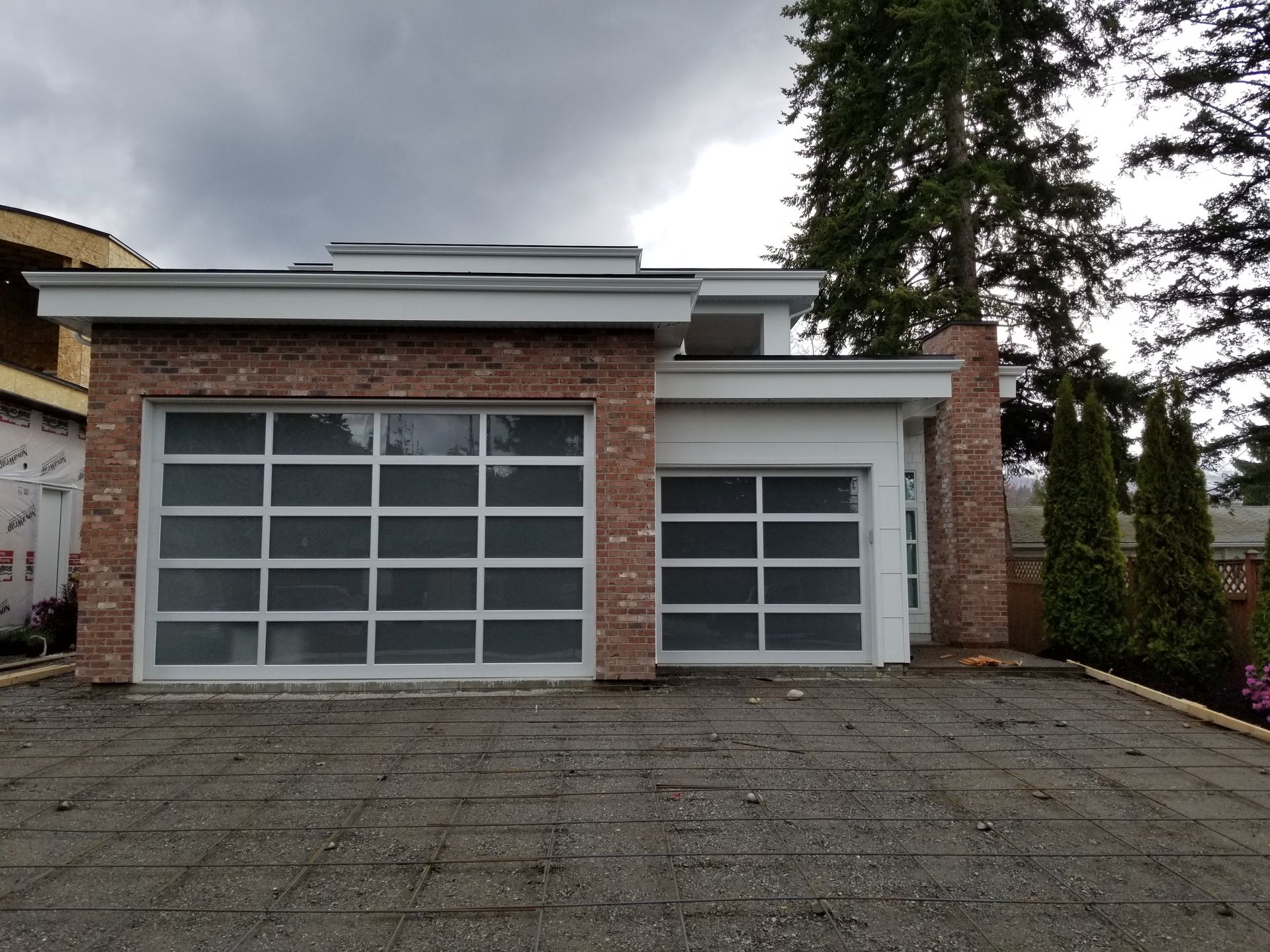 A brick house with a white garage door