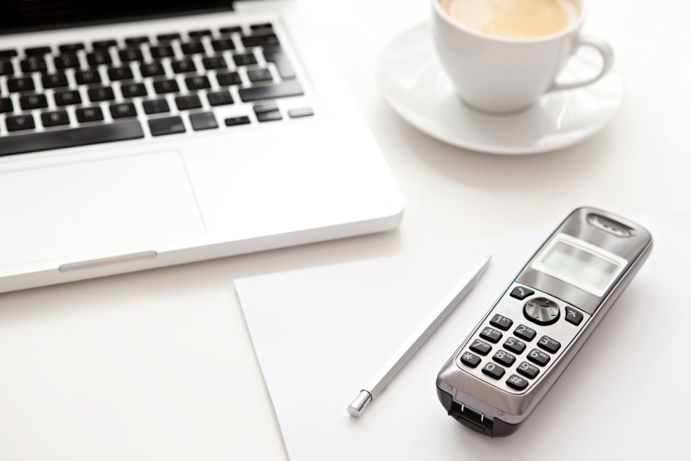 Close Up Detail View of a White Work Desk — Telecommunications in Noosaville, QLD