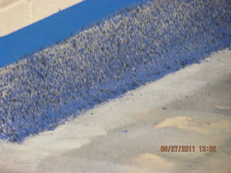 Blue and white landscape with a long, textured wall and a bright, sky-blue strip.