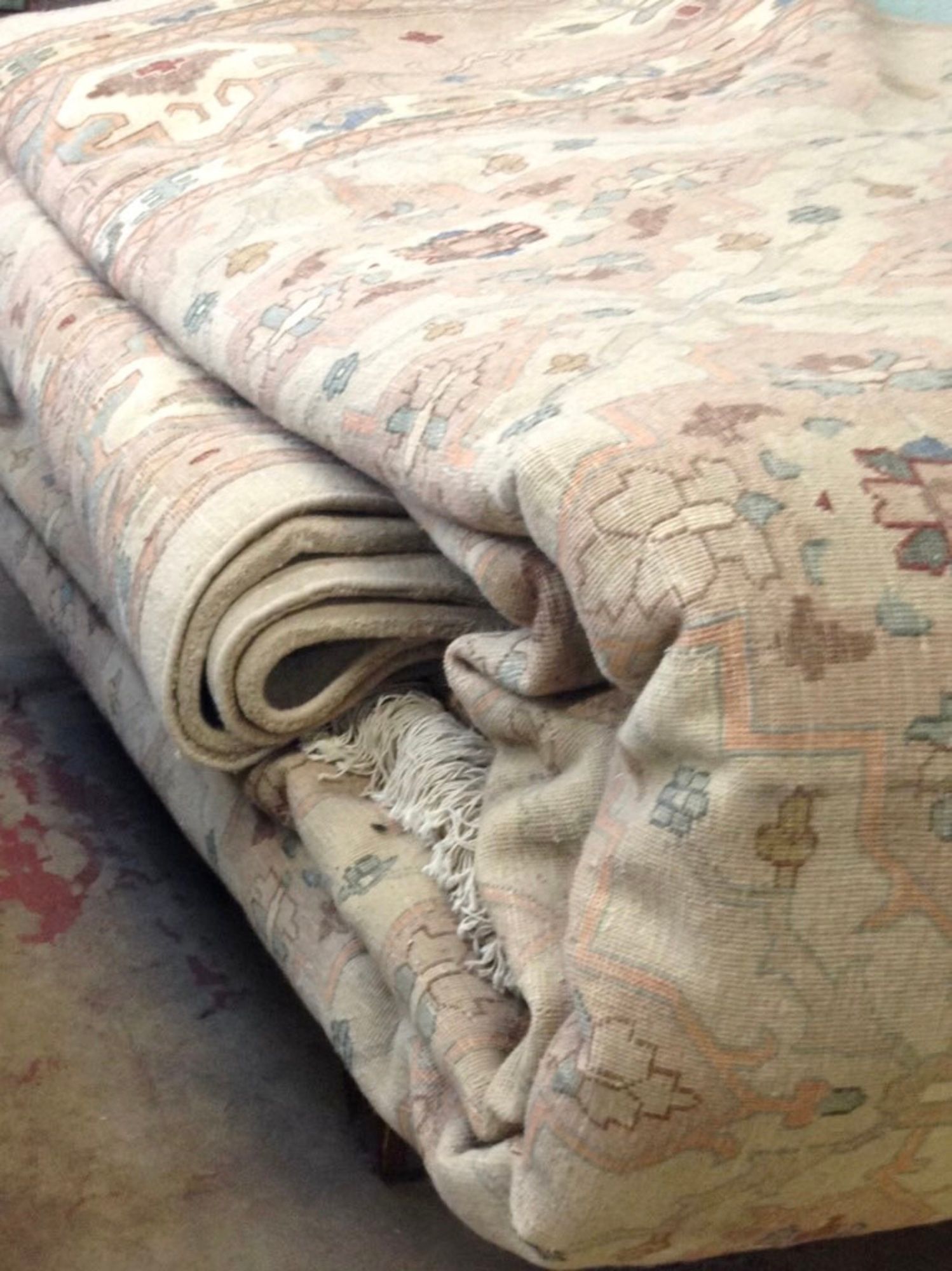 A stack of rugs sitting on top of each other on a table.