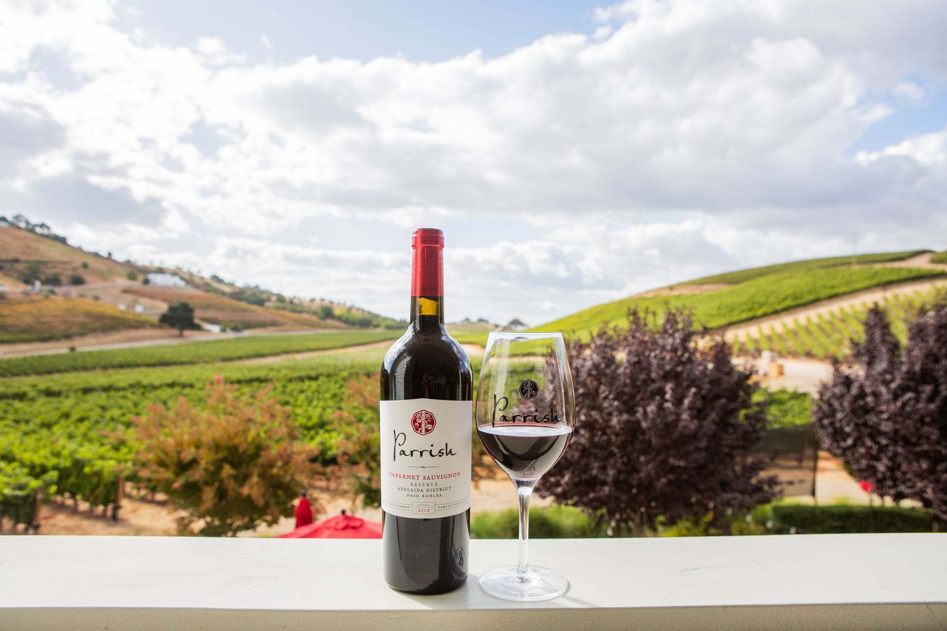 A bottle of parrish petit verdot wine is sitting on a table