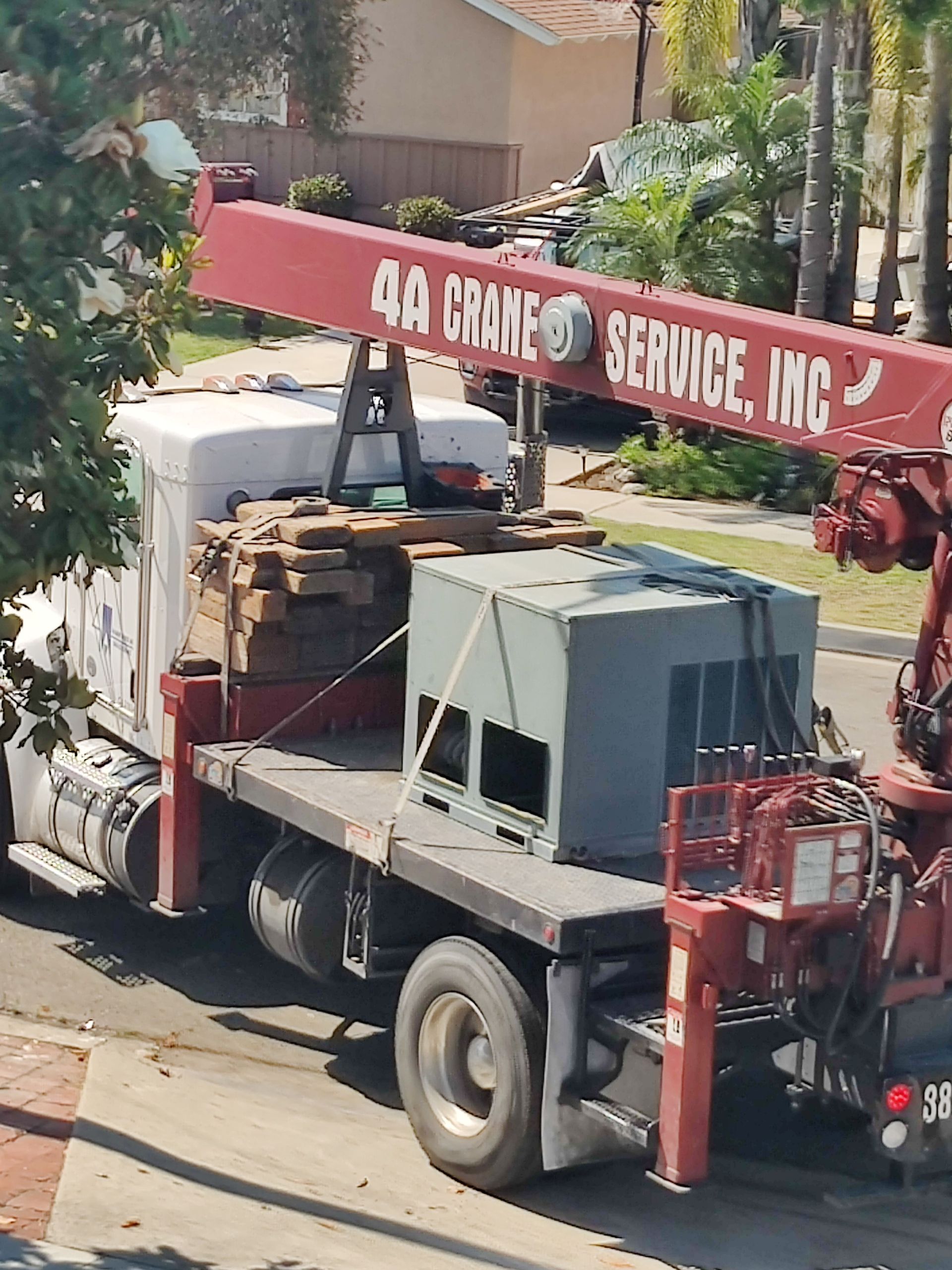 Truck with crane lifting equipment, 4A Crane Service, Inc. sign visible.