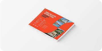 Red booklet with text and images on a white surface.