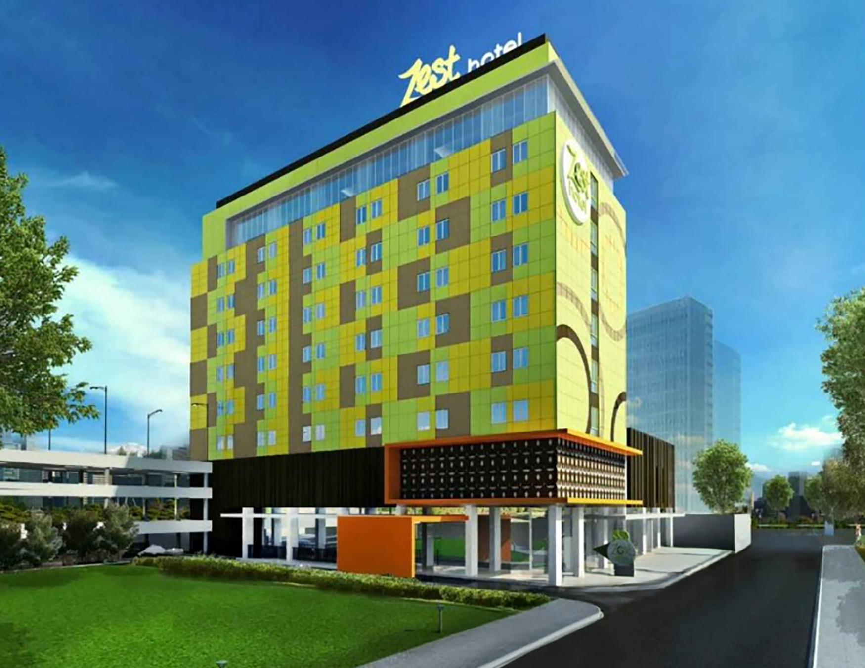 Four people at a grand opening event. Man in patterned shirt strikes a drum with a mallet.