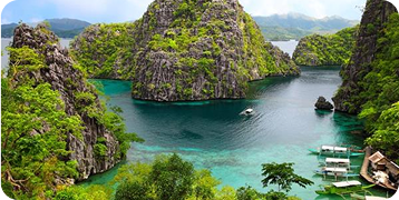 A group of boats are floating in a lake surrounded by mountains.