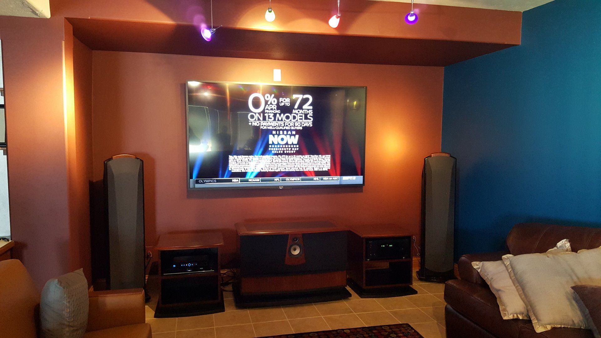A TV mounted on a wall with a home theater system in north central ohio