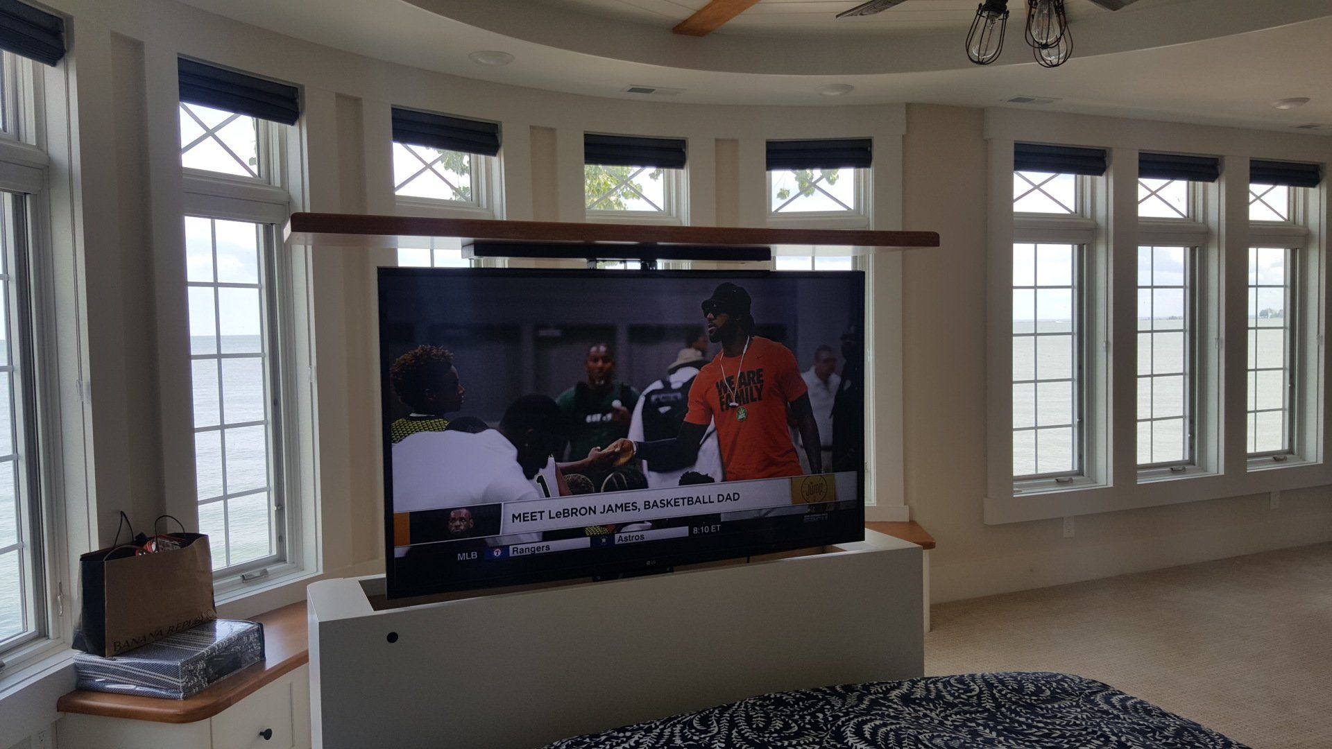 A large flat screen tv installed at the end of a bed in marblehead ohio