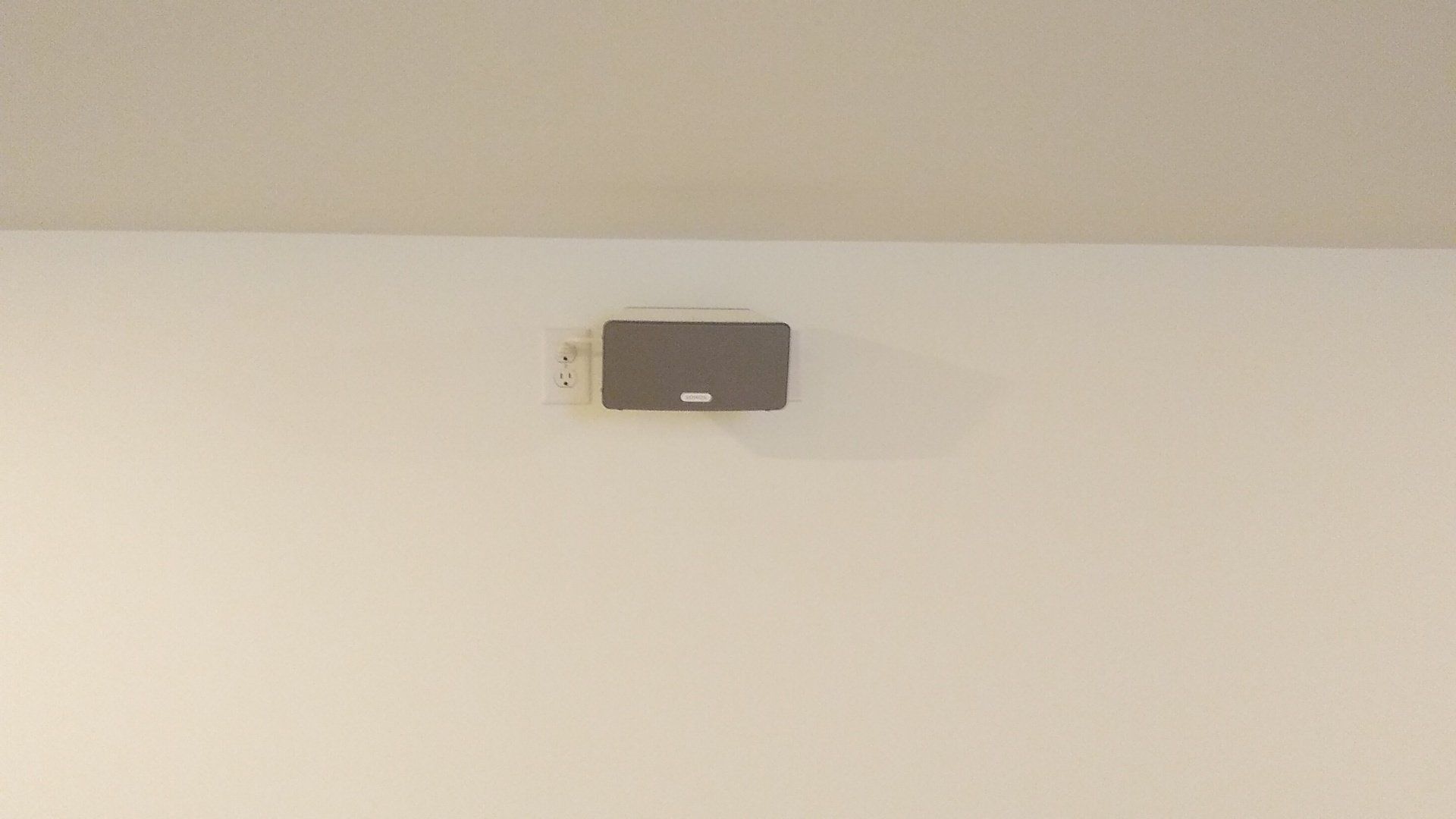 a sonos speaker mounted in on the wall by fisher electronics in northern ohio