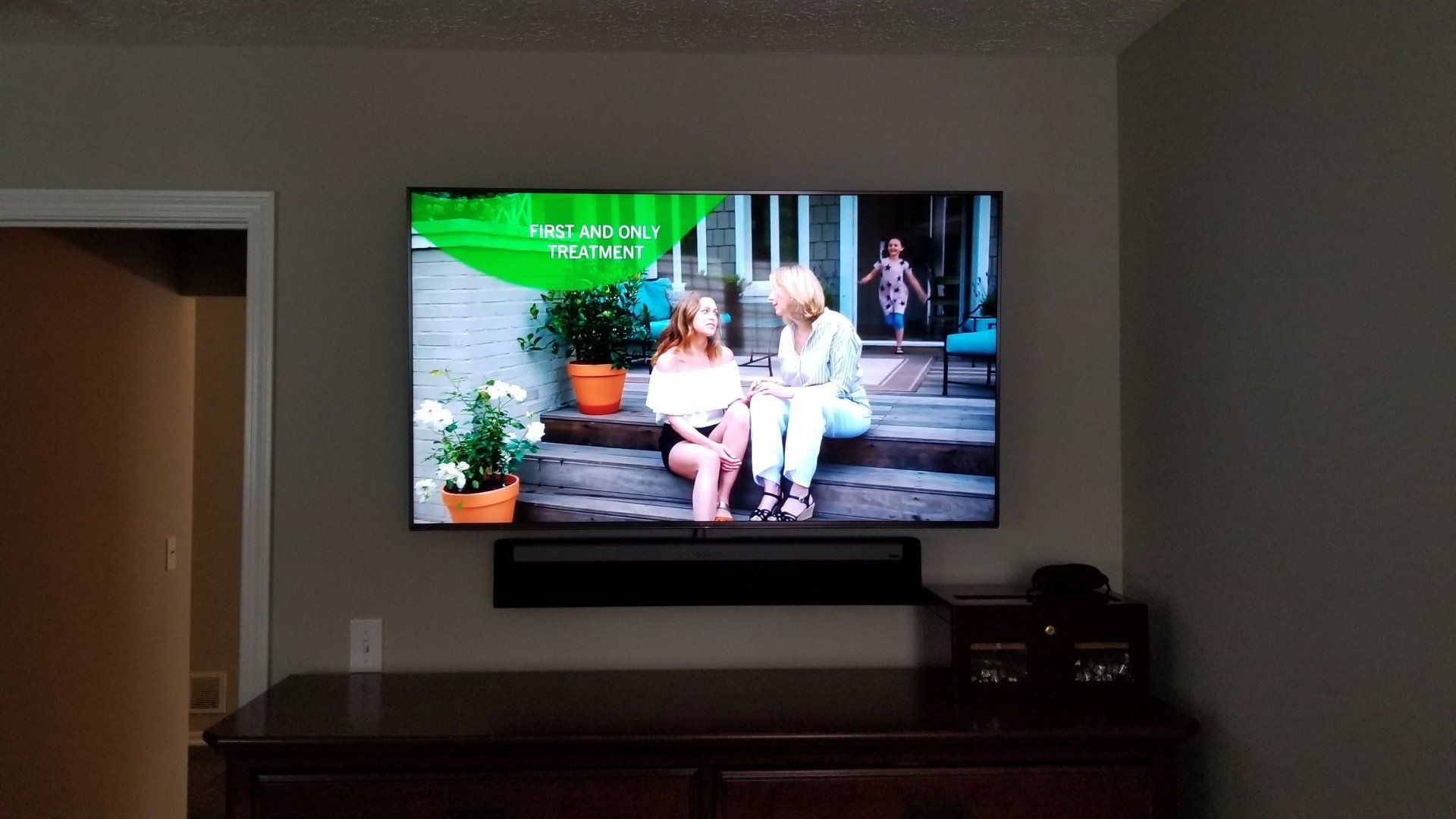 a tv mounted on the wall with a sonos soundbar mounted with the TV installed by fisher electronics in northern ohio.
