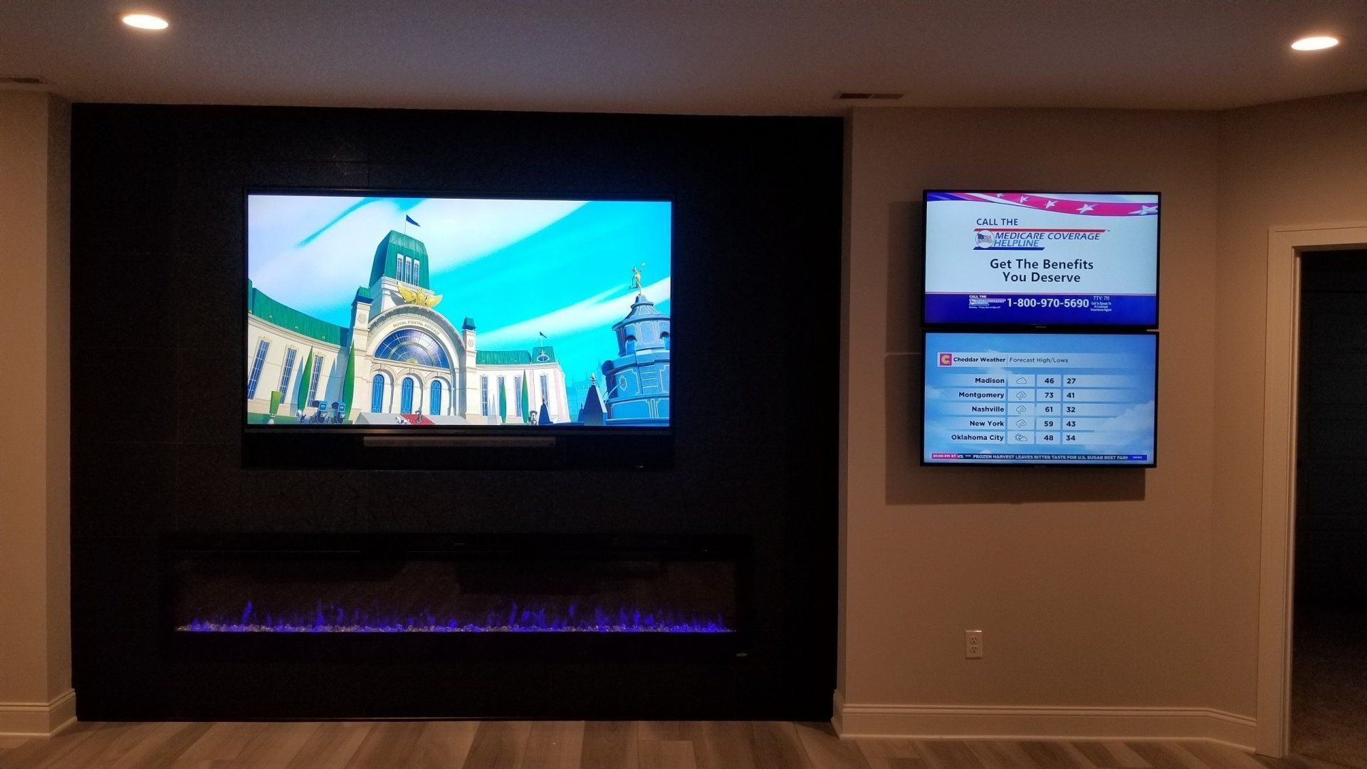 three televisions are mounted on a wall used for picture in picture in north central ohio