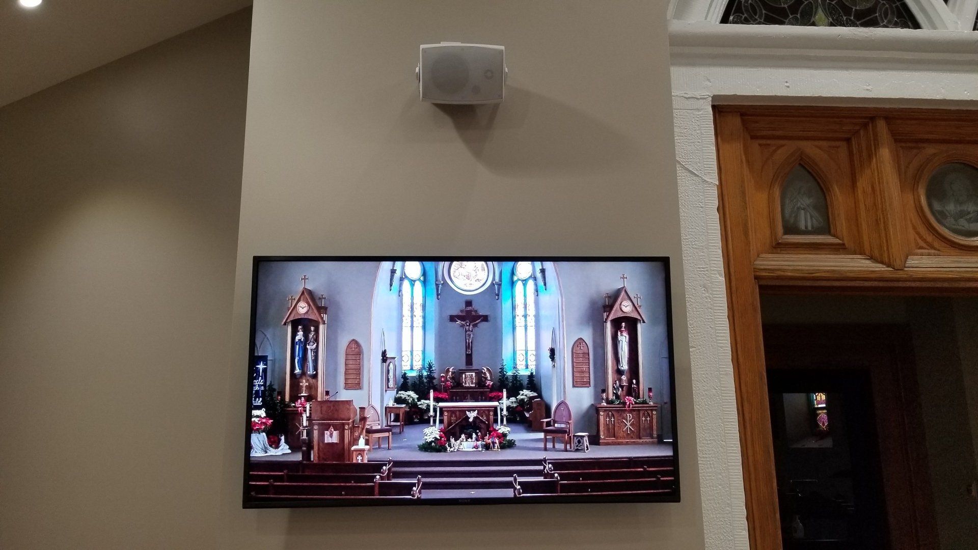 a large flat screen tv shows the inside of a church in northern ohio