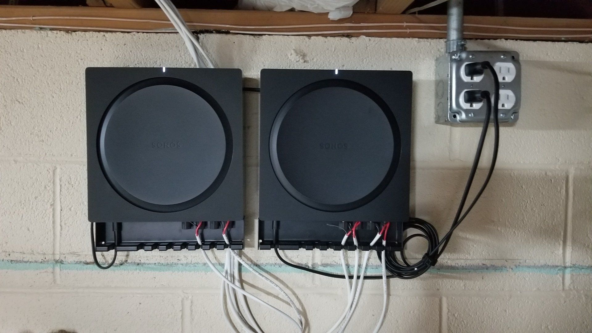 two sonos amps are connected to a wall for outdoor audio installed by fisher electronics in northern ohio.