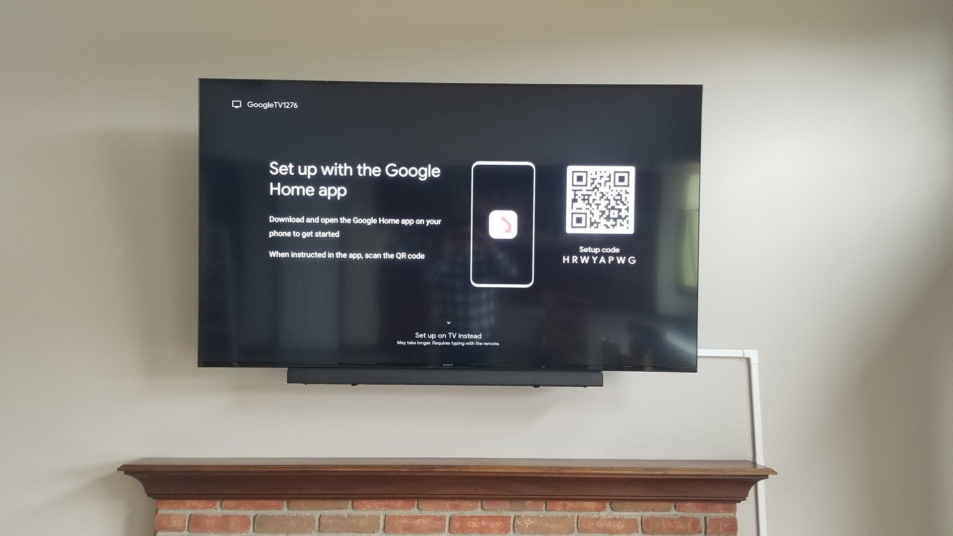 a TV mounted on a wall with a soundbar in north central ohio