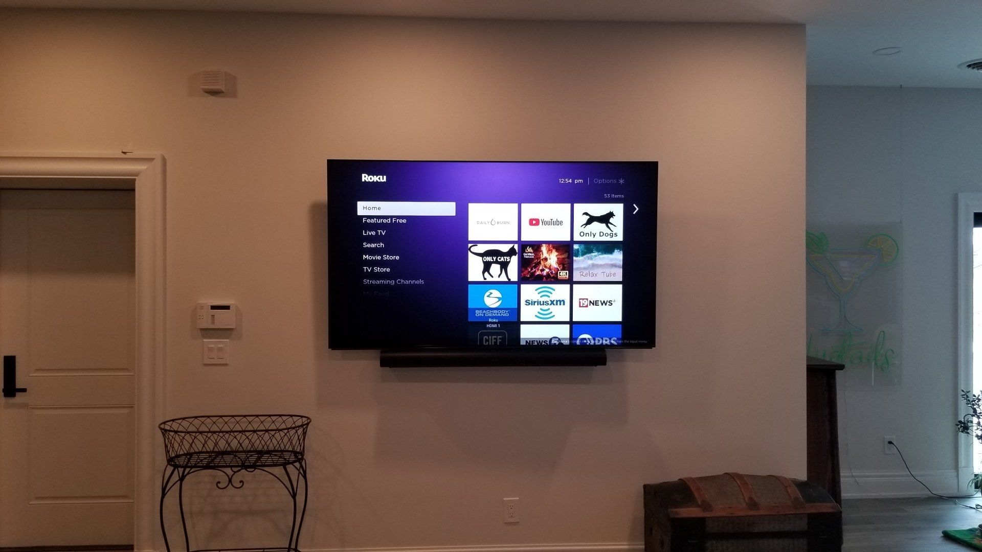 a TV is mounted on a wall in a living room in northern ohio