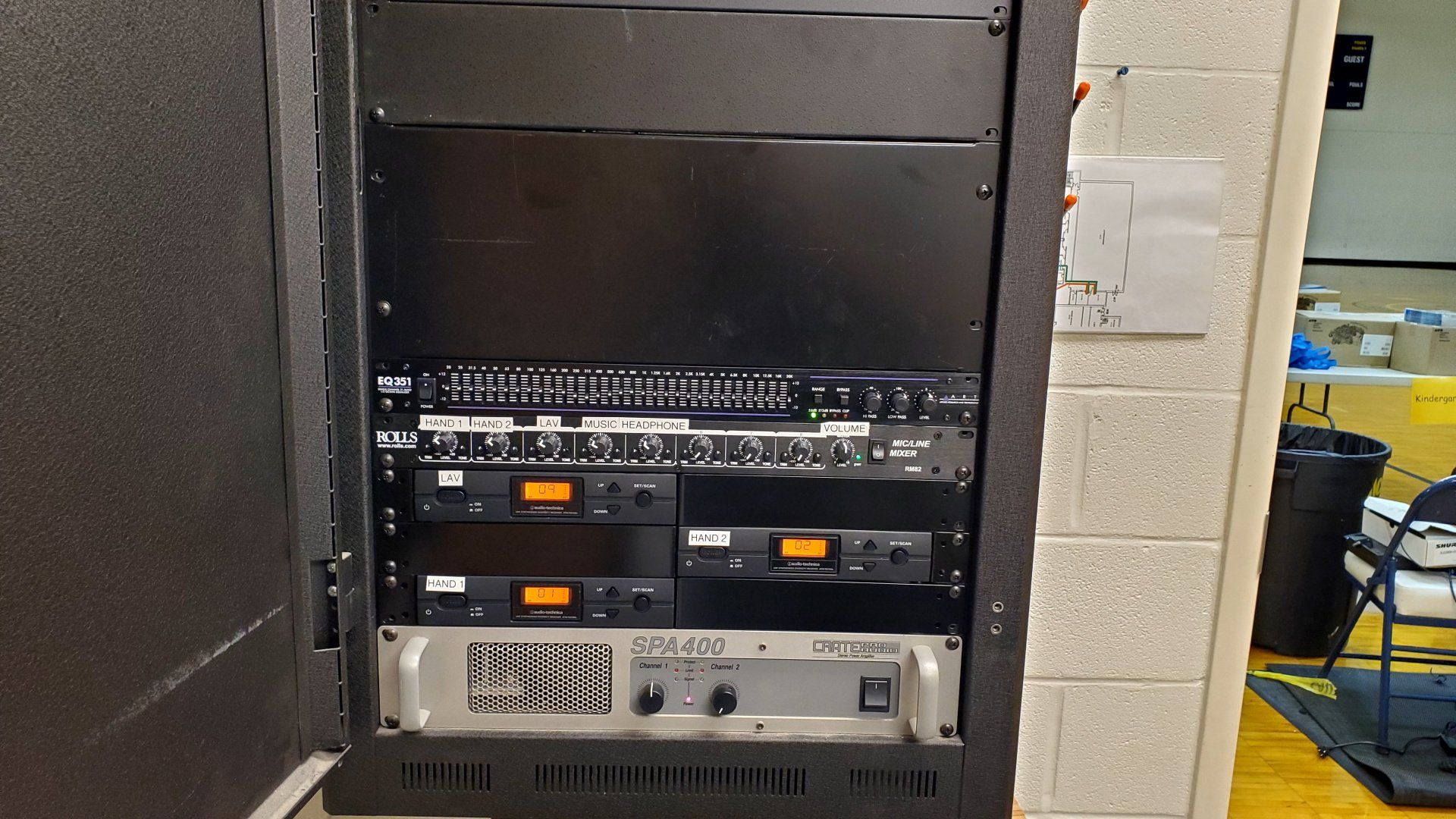 A rack with an amplifier microphone receivers and other audio equipment installed in it in northern ohio