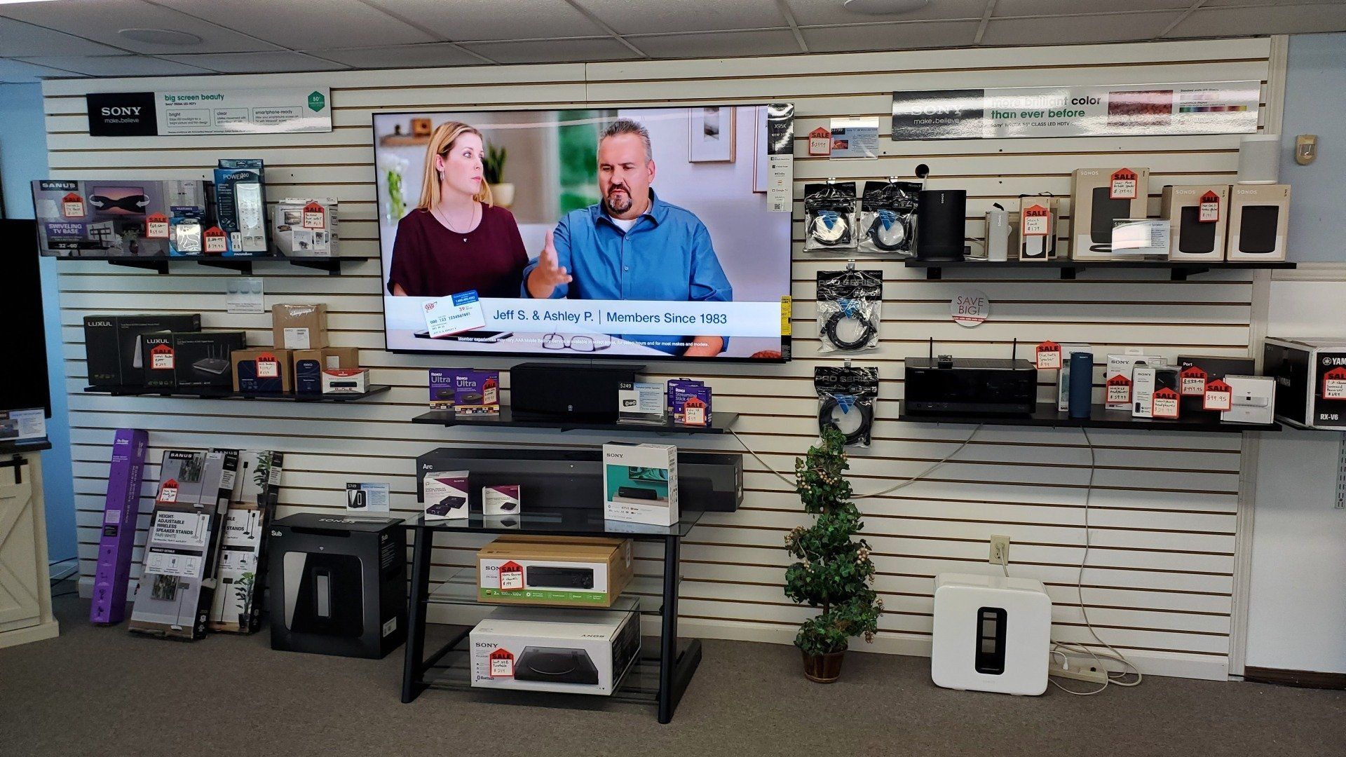 a sony tv, sonos equipment, audio receivers, and wifi mesh systems are on display at Fisher Electronics showroom