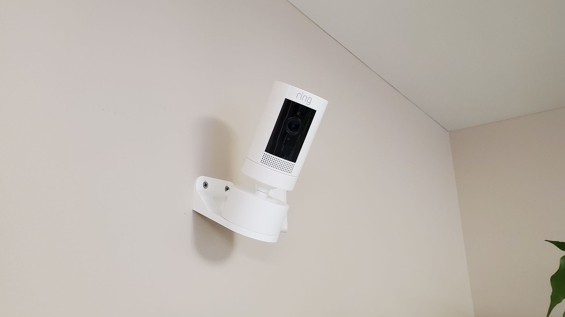 a security camera is mounted on a wall in a room.
