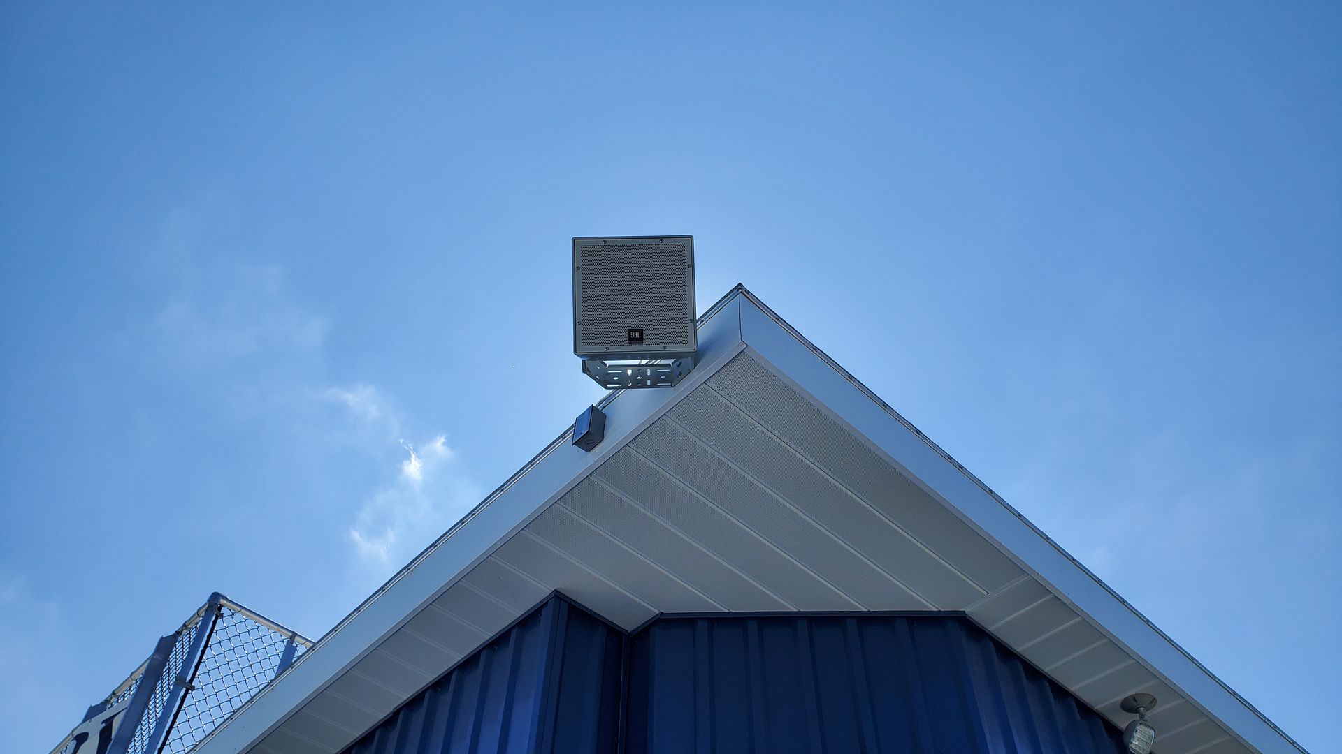 an outdoor speaker on top of a football field press box for the outdoor audio at the football field in northern ohio