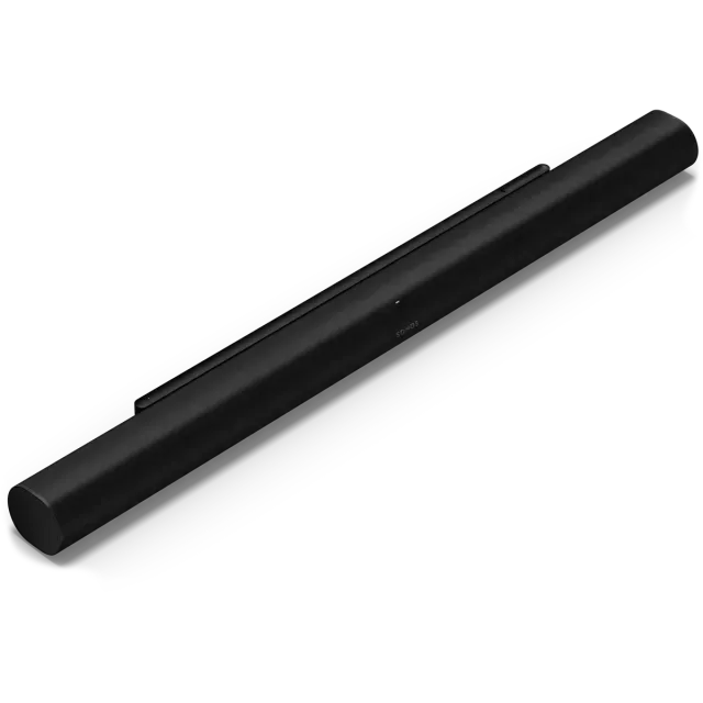 A black sound bar is sitting on a white surface.