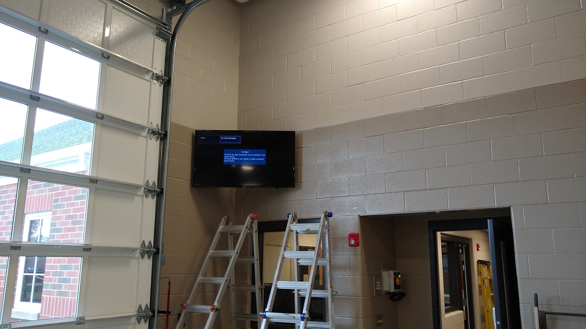 a TV mounted on a wall in the corner with a full motion wall mount in north central ohio