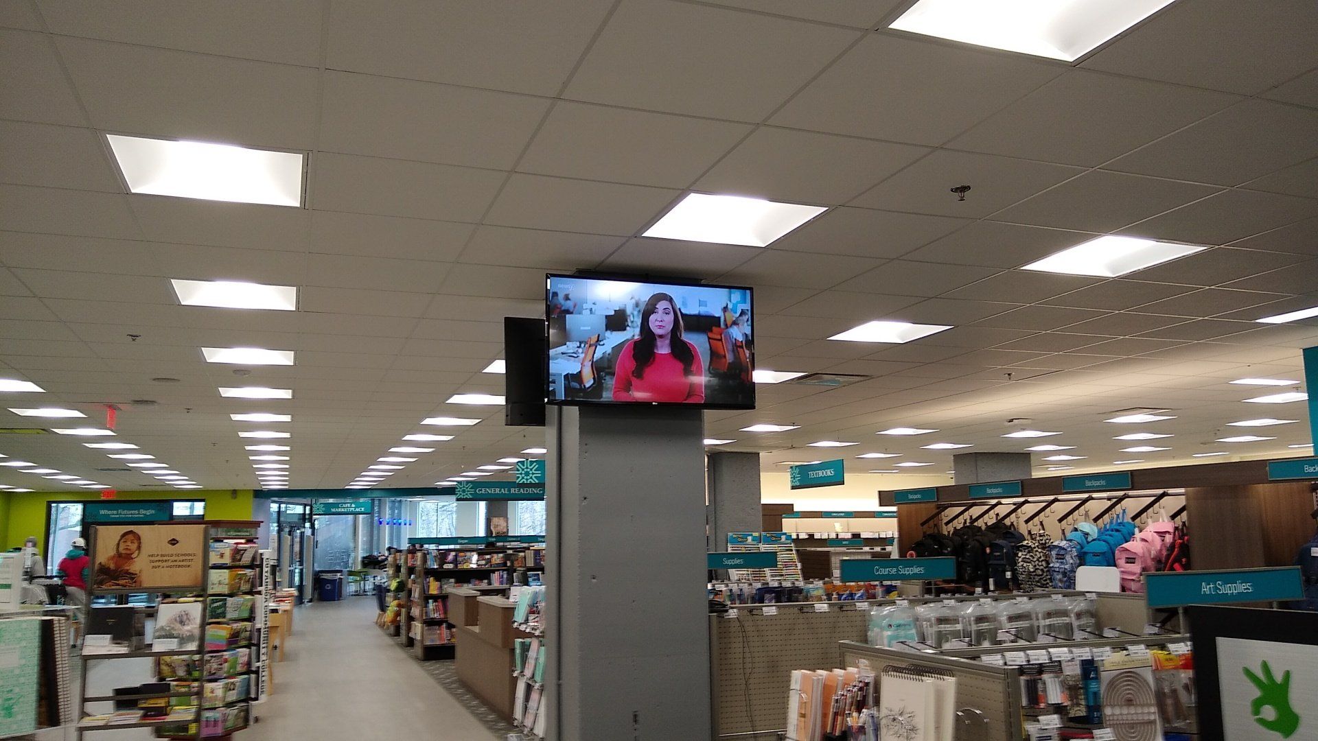 a commercial store with two TVs mounted to the column in north central ohio