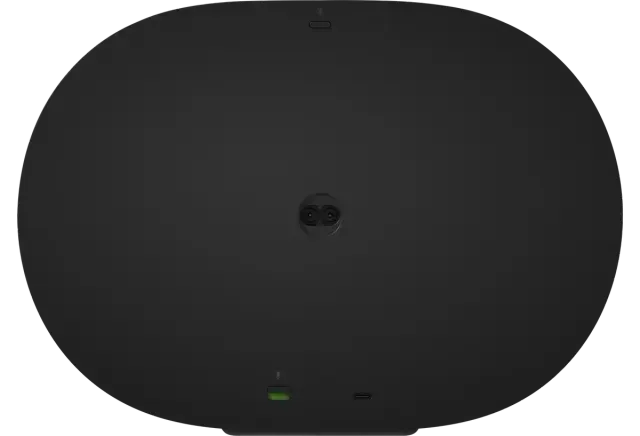 A black circle with a green light on the bottom