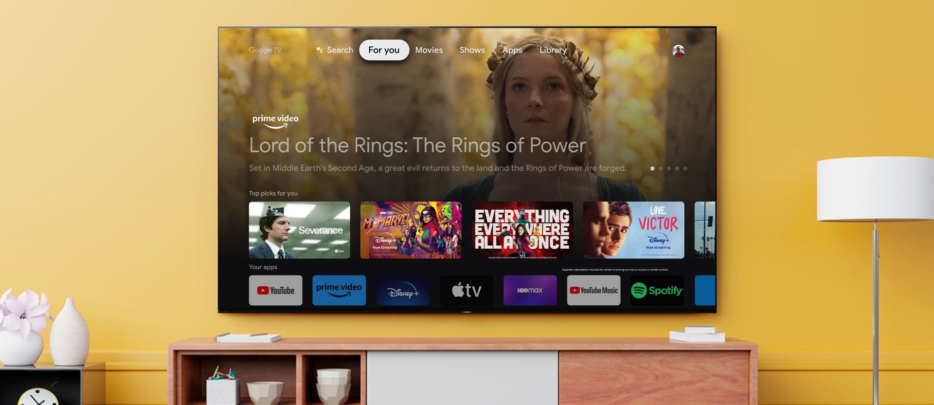 a sony oled tv screen shows a movie called lord of the rings and other smart tv apps